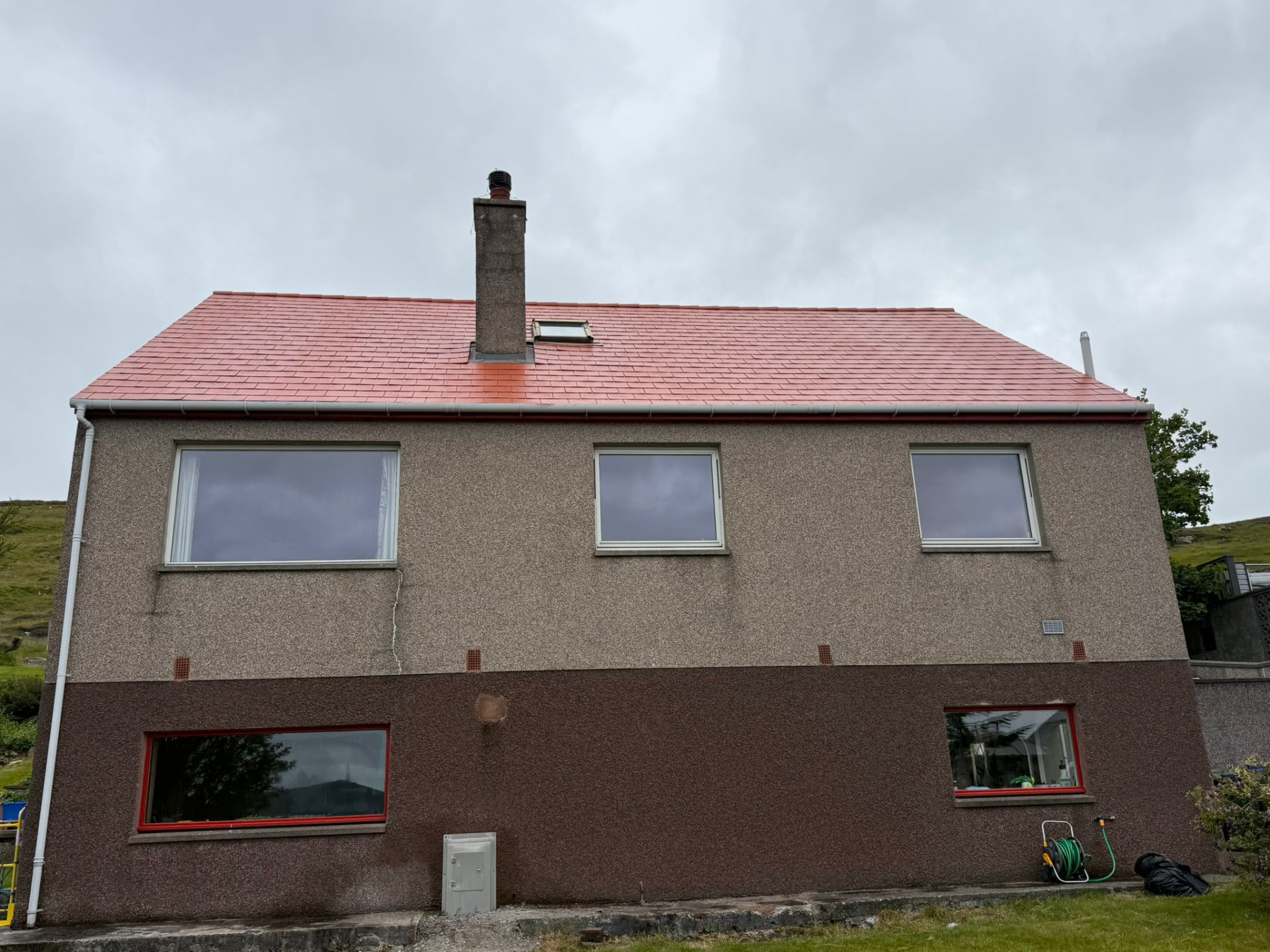 Roof coating on a two-storey Shetland home: after the work