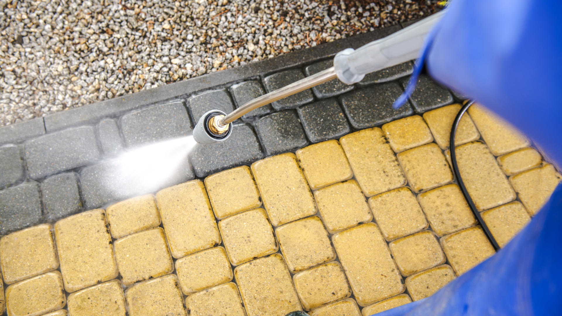 Driveway cleaning in Shetland: block paving being washed back to a clean, even finish